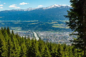 The City of Innsbruck in the valley, cradled by mountains and forest