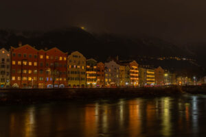 One of the most common photos taken in Innsbruck, Mariahilf across the river. The colourful buildings along the riverside have a special charm. I'm happy to have caught the reflection of the colour of the buildings with their Christmas lights in the river.