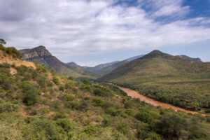 The hills seem to be endless, as the river is coming down while driving up the canyon