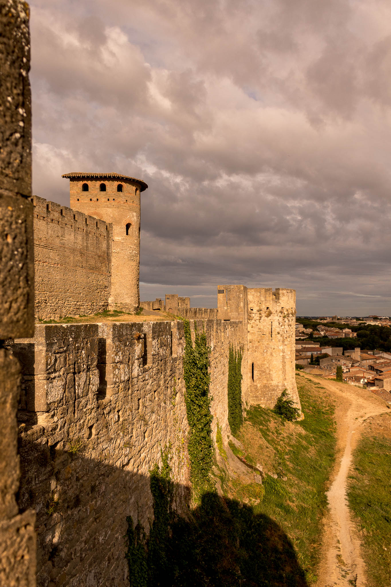 Outside Walls of Carcassonne The morning light on the fortified walls for the Cite of Carcasonne. At this hour the place is still quiet, but won't be for long as tourists will be coming soon