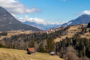 After the snow has melted the grass is still brown from the winter. The hay barns on the field appear empty. Time for things plants to start growing again? Nature definitely seems to be in the process of waking up.